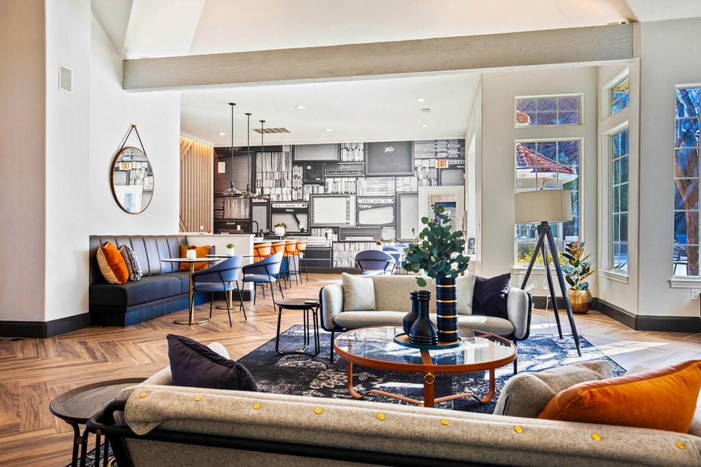 a living room with couches and a table at The Olivine, Texas